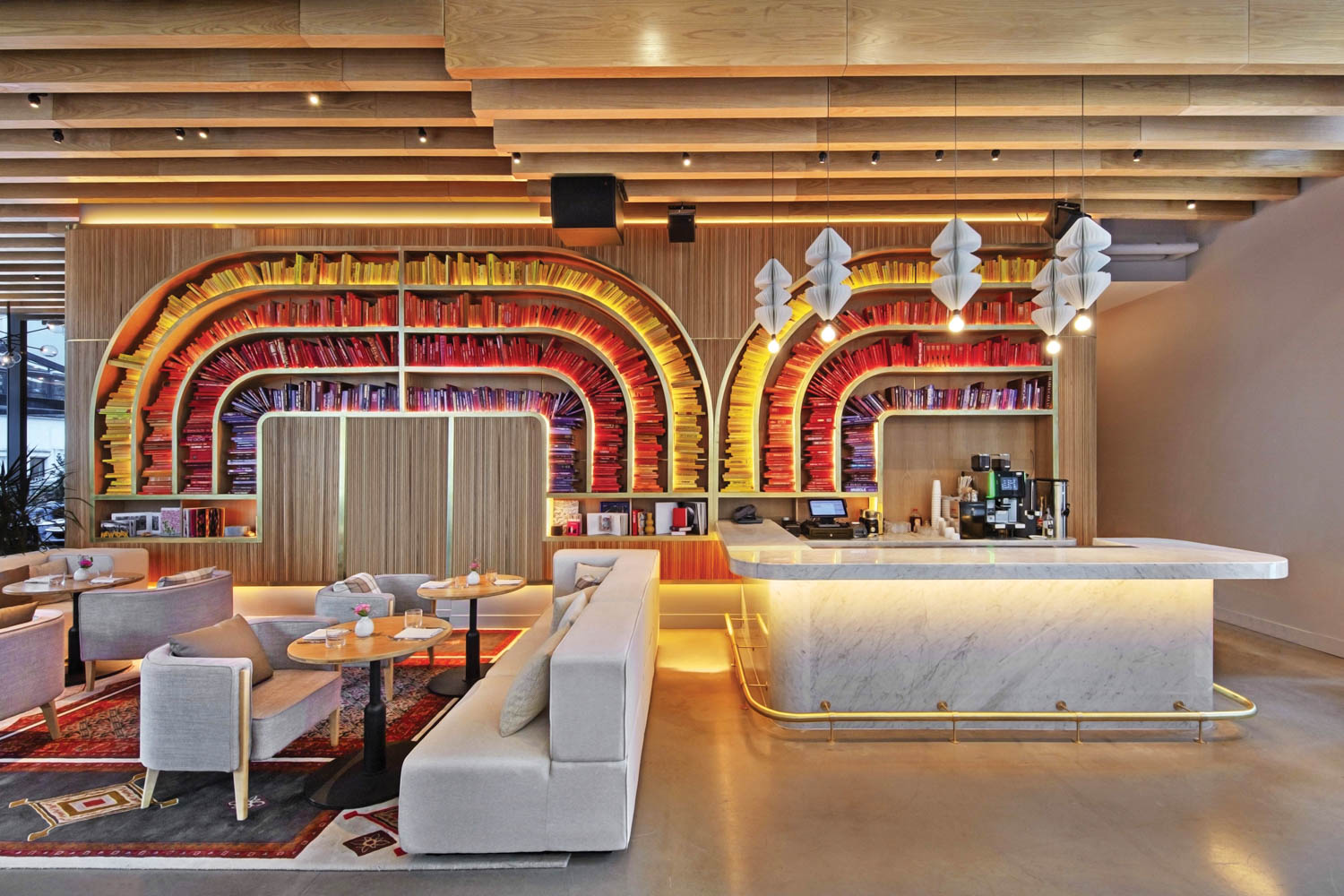 two rainbow archways in the lobby of virgin hotels