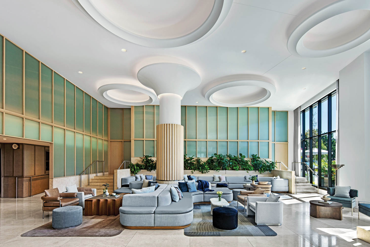 the lobby of the Morrow Hotel with green ribbed-glass panels framing it