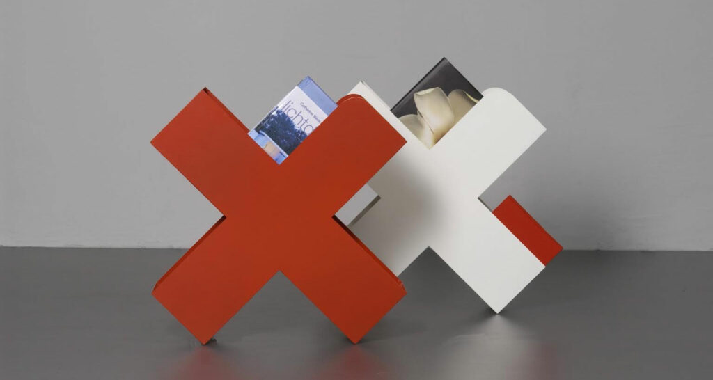 a bookshelf in the shape of red and white xs