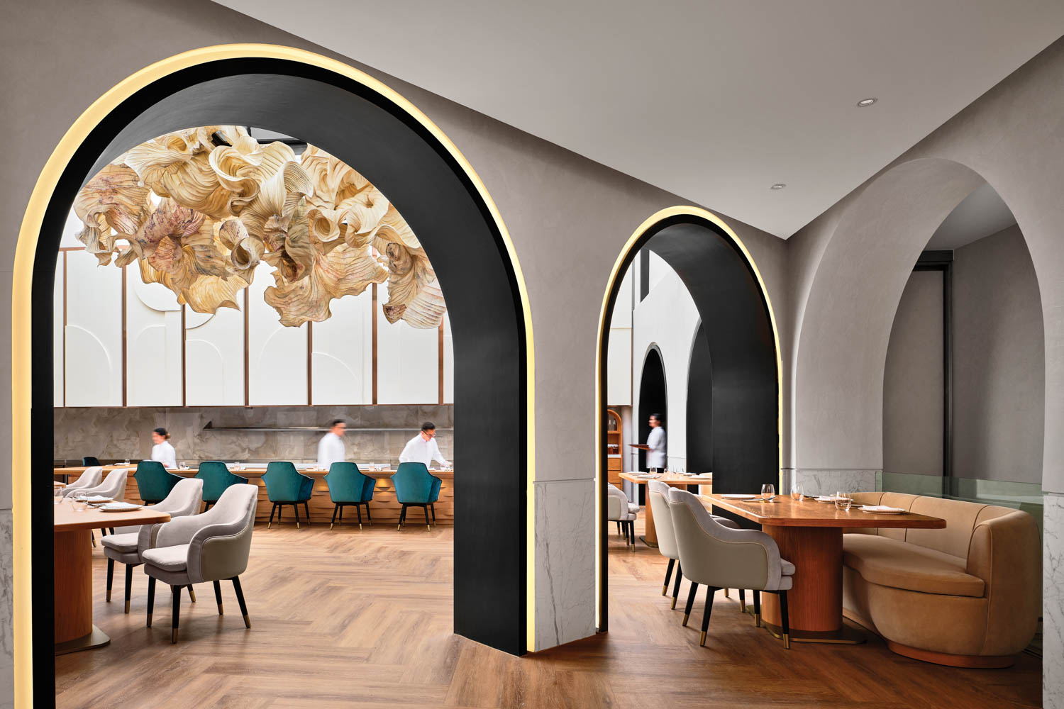 arches lined with blackened steel in the dining area of Restaurant Born in Singapore