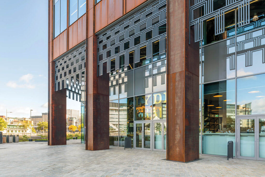 brown pillows and a glass facade exterior