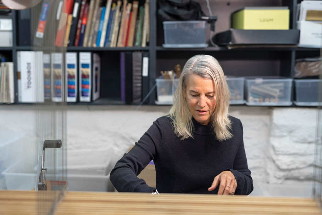 Suzanne Tick working at the loom