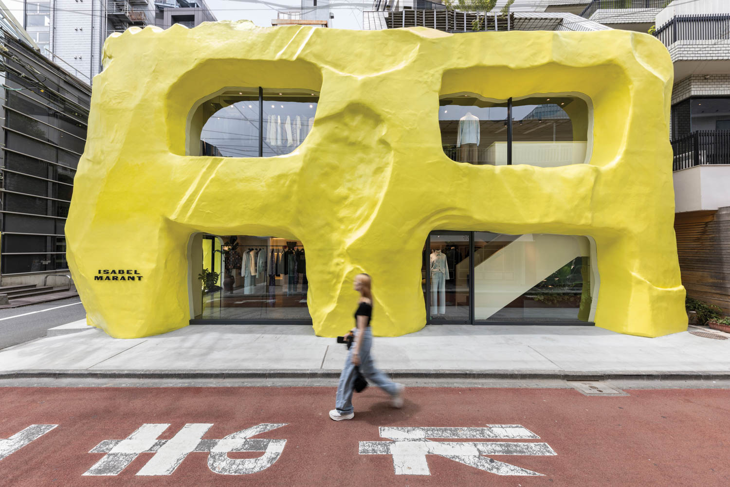 A yellow biomorphic facade