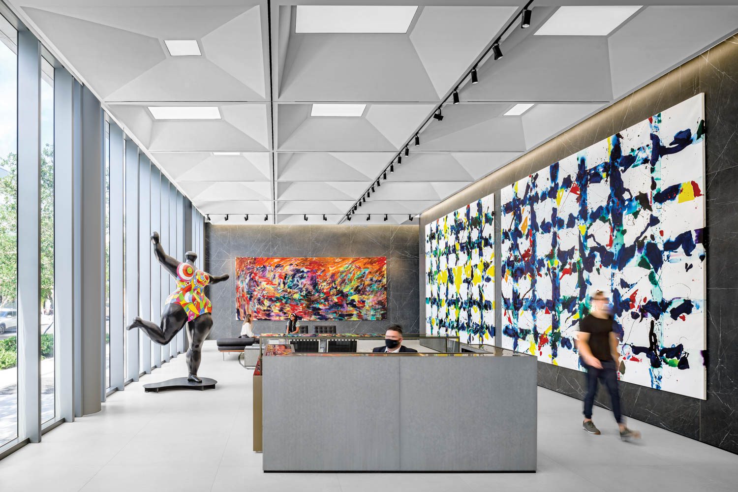 MKDA puts a modern spin on a classic coffered ceiling in the art-filled lobby of developer Related Group’s headquarters building in Miami; the colorful statue is by Niki de Saint Phalle.