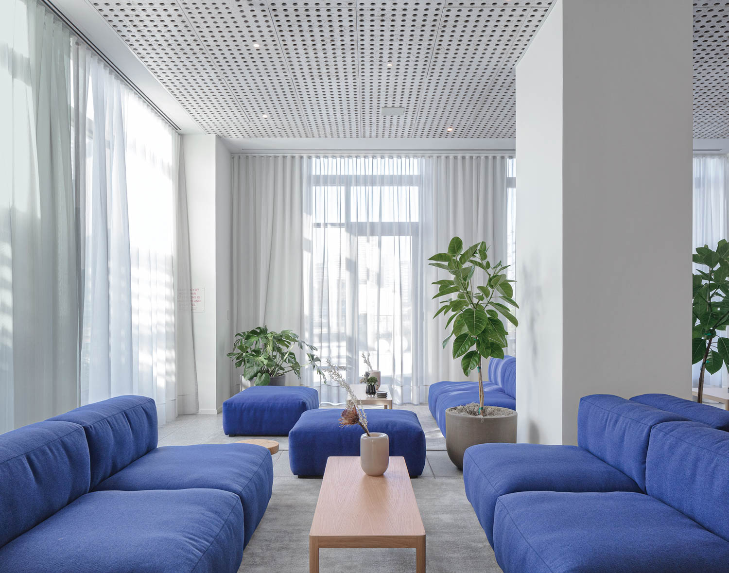 blue seating defines this residential lounge