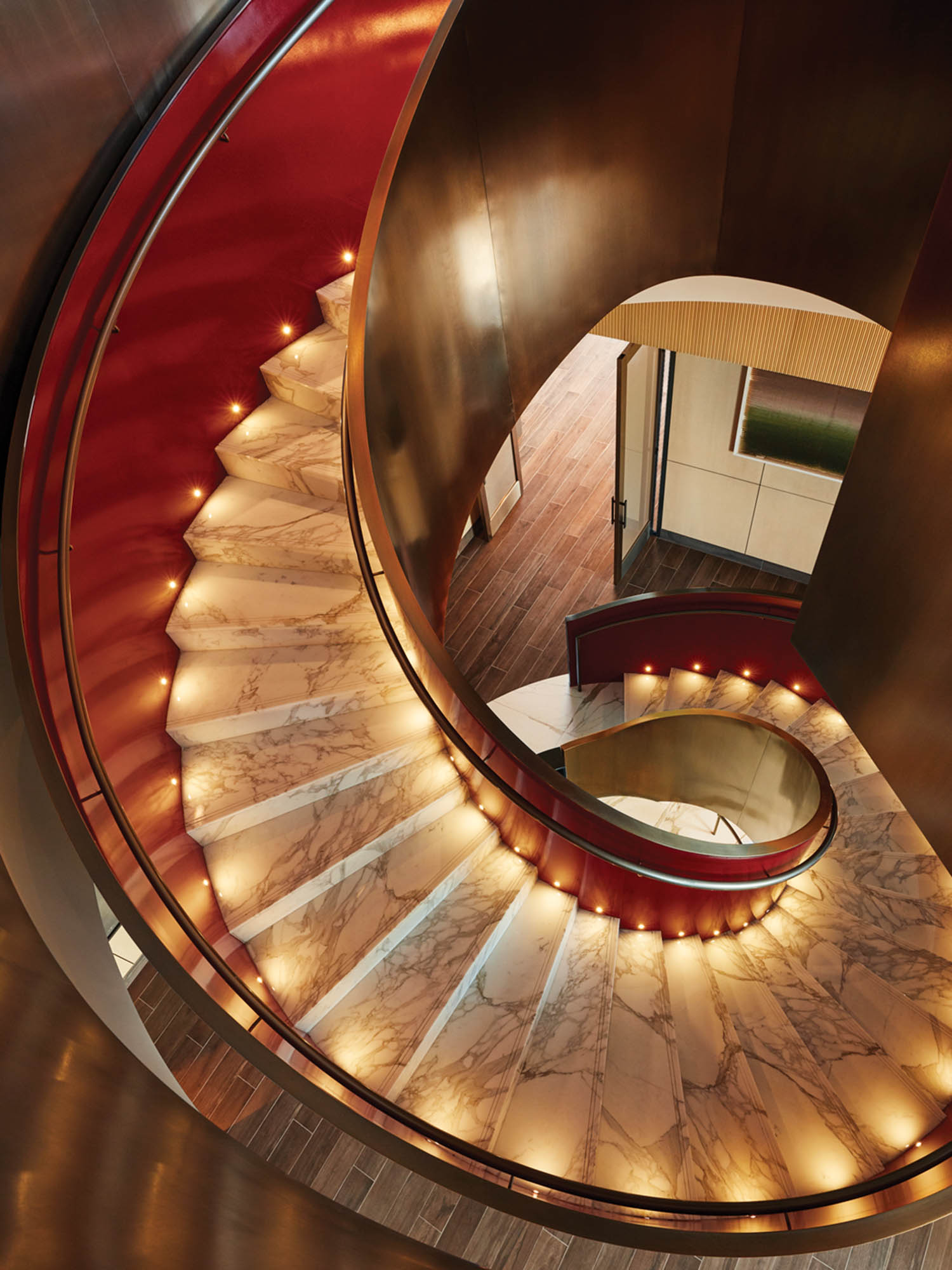 a spiral staircase in gold marble