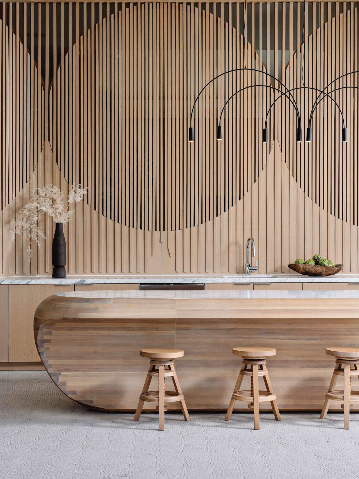 wooden trim makes shapes on the wall in a residential lobby