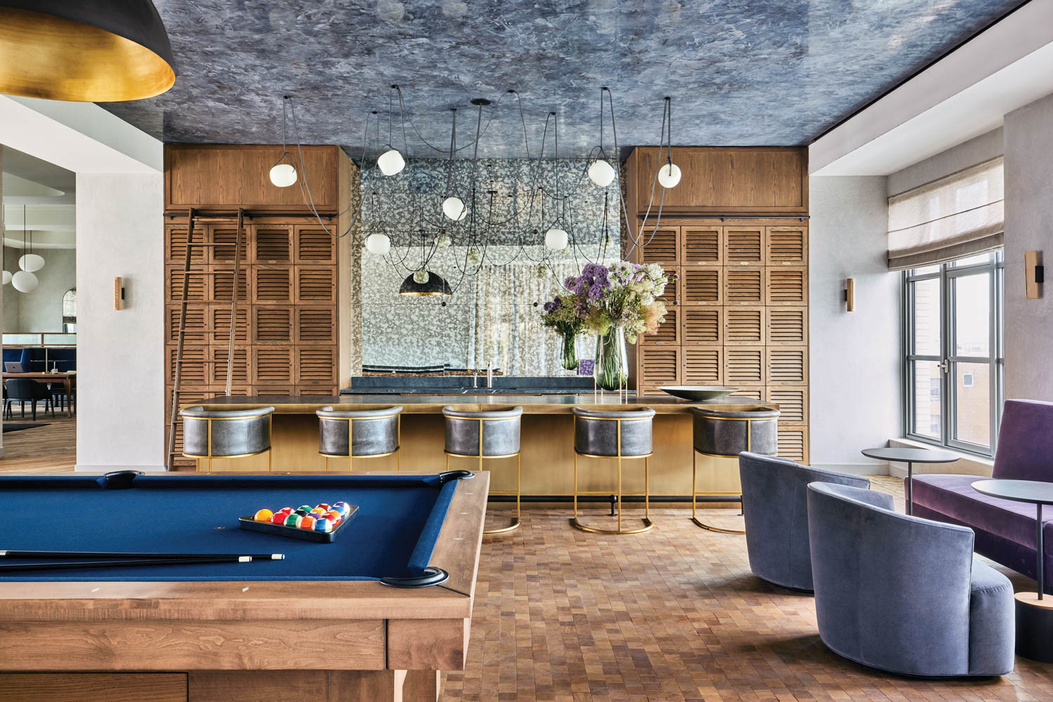 billiards tables in the lobby of a DUMBO condo building