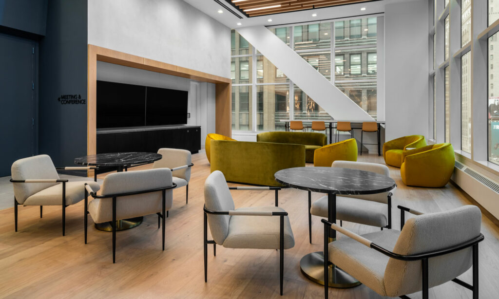 A common area with tables and chairs and Nydree Flooring