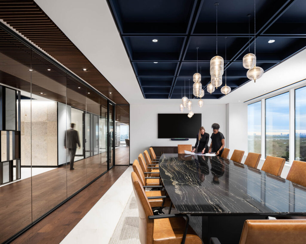 the main conference room illuminated by chandeliers at Mohr Capital in Dallas