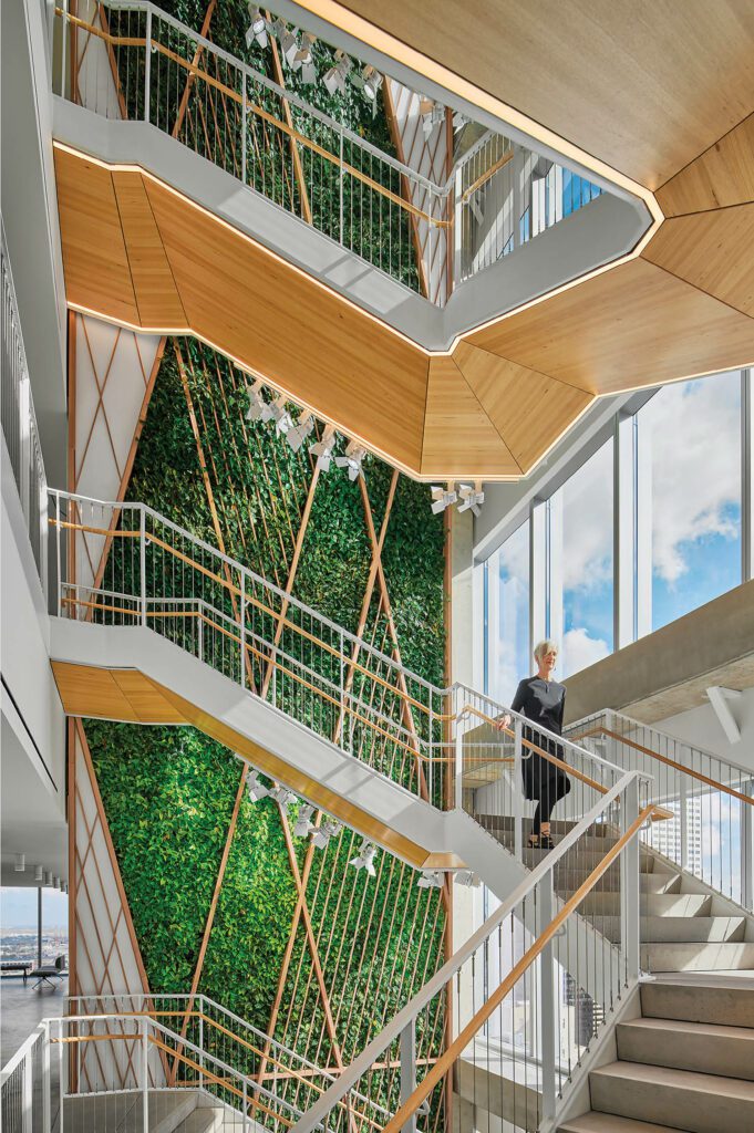 A person walks down a winding staircase at Waste Management