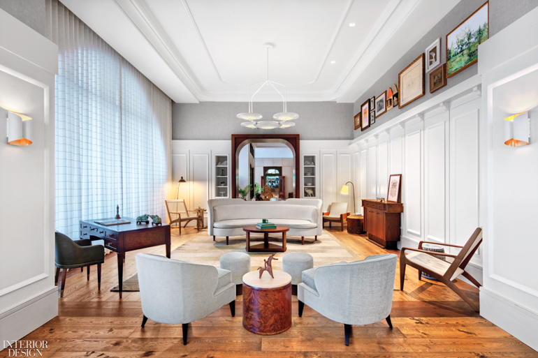 The lounge in the Perry Lane Hotel features wood flooring and antique furnishings