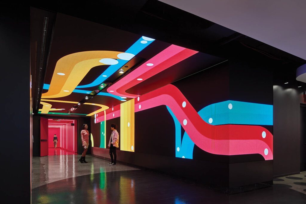 In an elevator vestibule at TikTok’s Midtown office by Gensler, 12-inch-square next-gen LED panels are arranged to reflect the energy of its Times Square location.