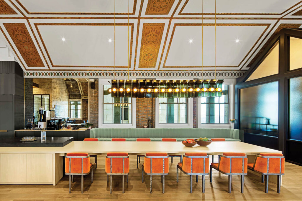 dining area with bright orange chairs