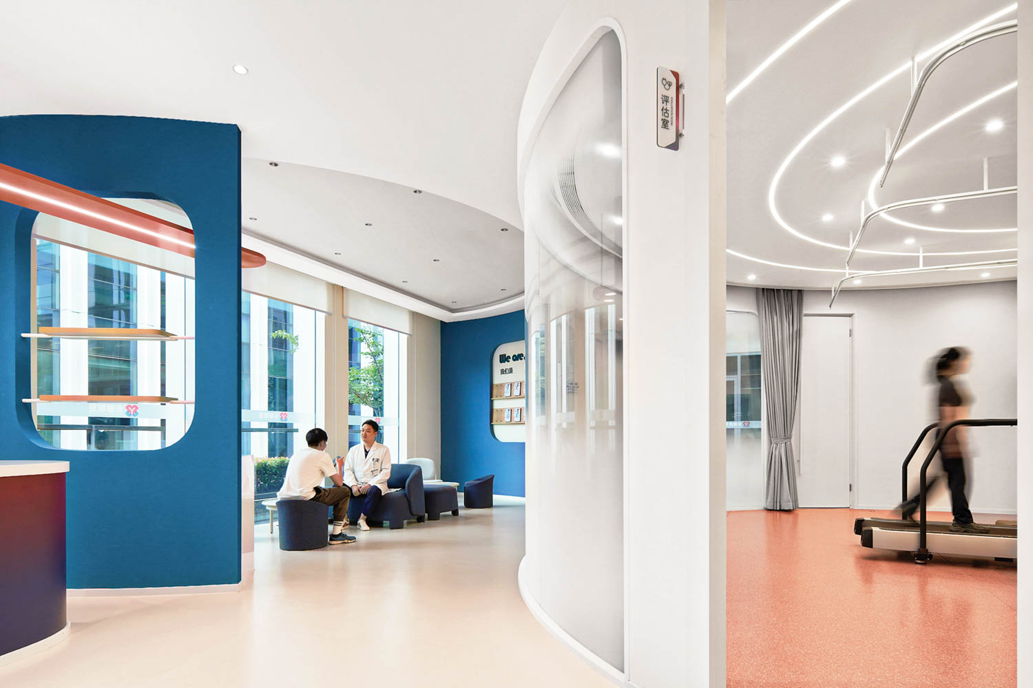 room with dark blue walls and people walking around