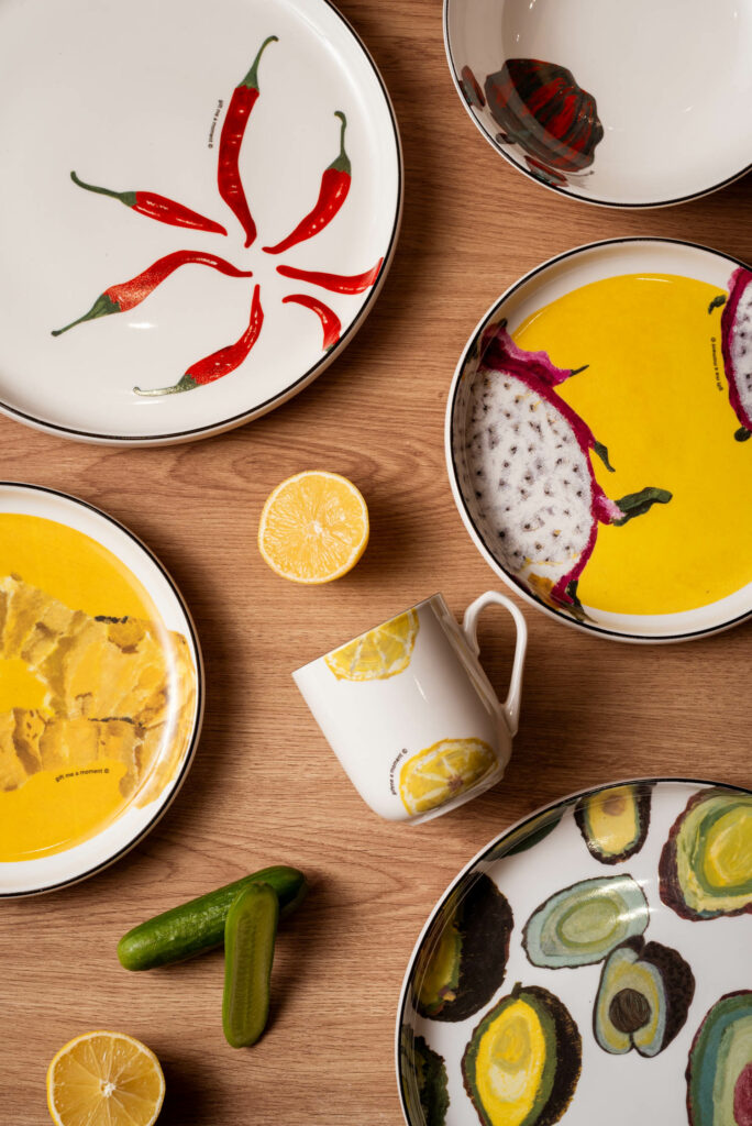 table with multiple yellow dishes and cups