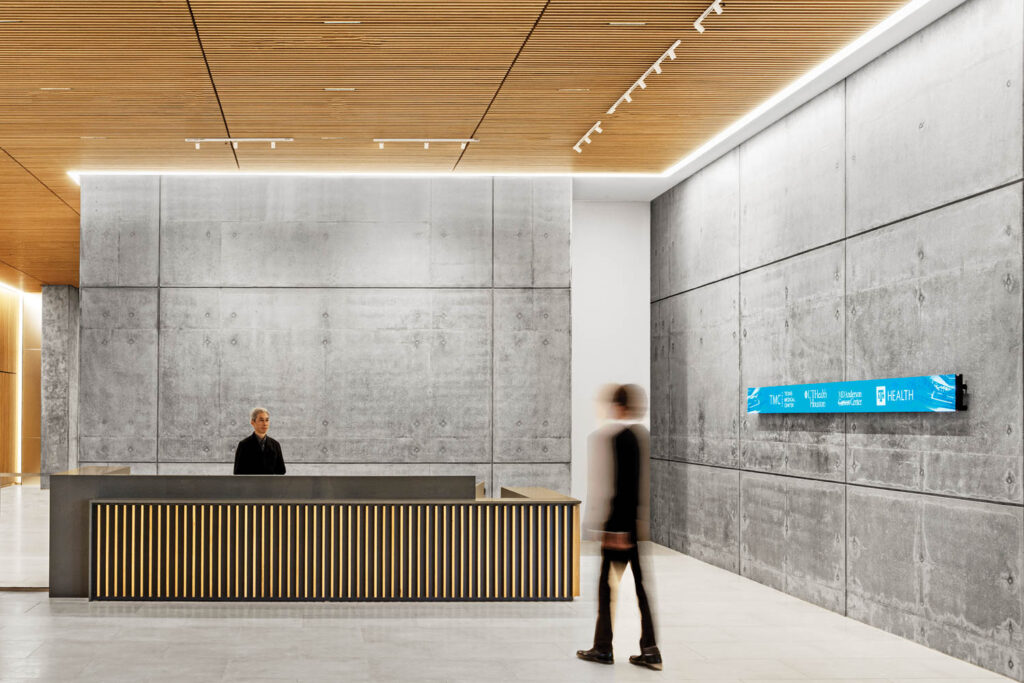 reception desk with concrete walls and wooden ceiling