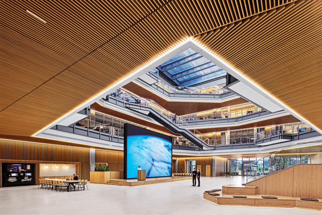 view of reception with slatted ceiling and brightly lit space