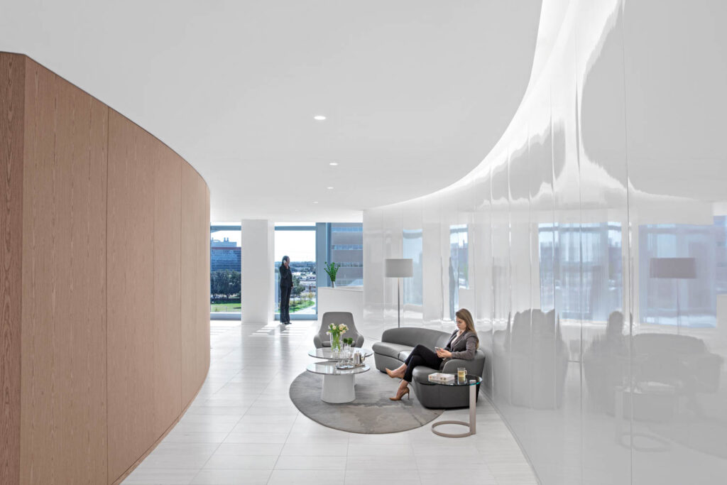 executive corridor wall in all white with grey seating