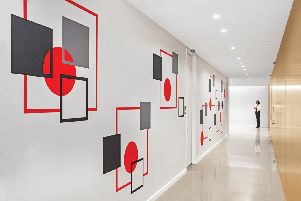 white corridor with red and black graphics