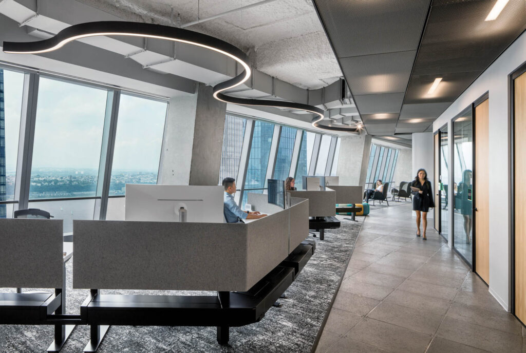 a gray reception desk with led lighting above