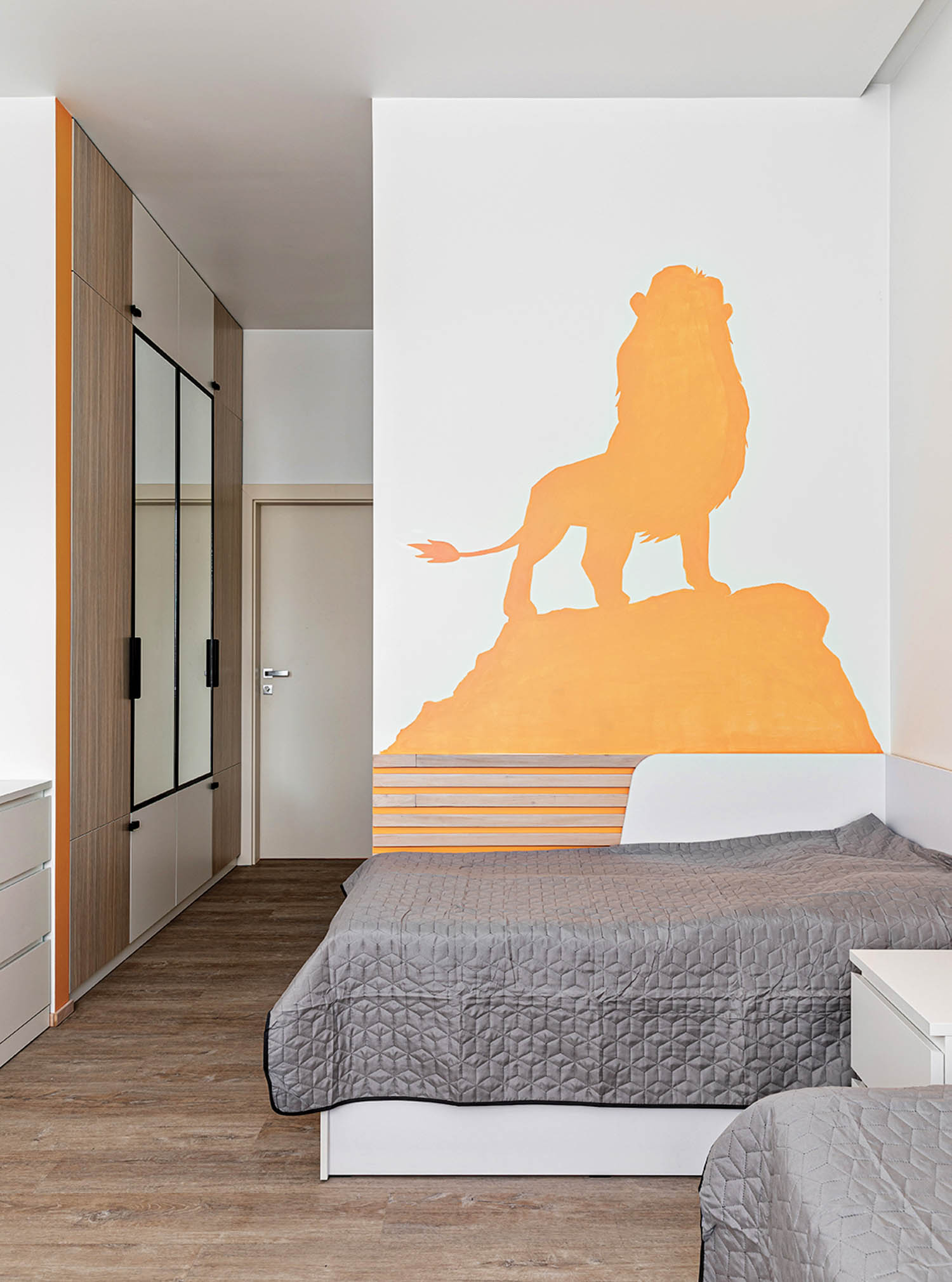 bedroom with decals reminiscent of The Lion King