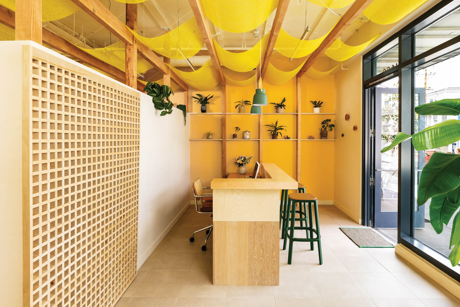 lobby area with bright yellow walls and lofty ceilings