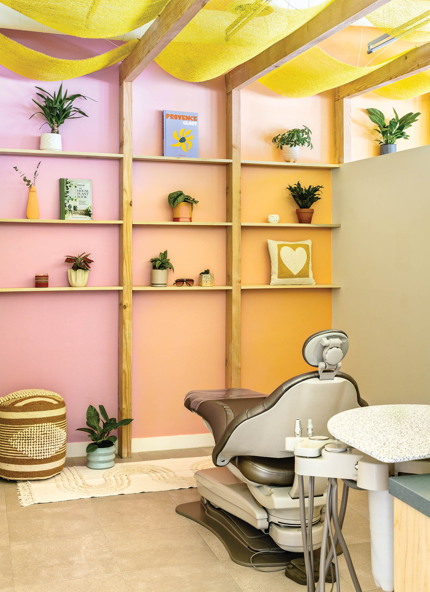 dental cleaning area with ombre walls and shelves filled with knicknacks