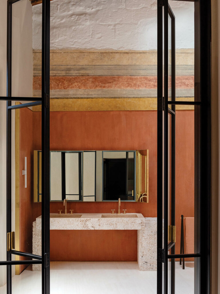 bathroom with tan walls and white flooring