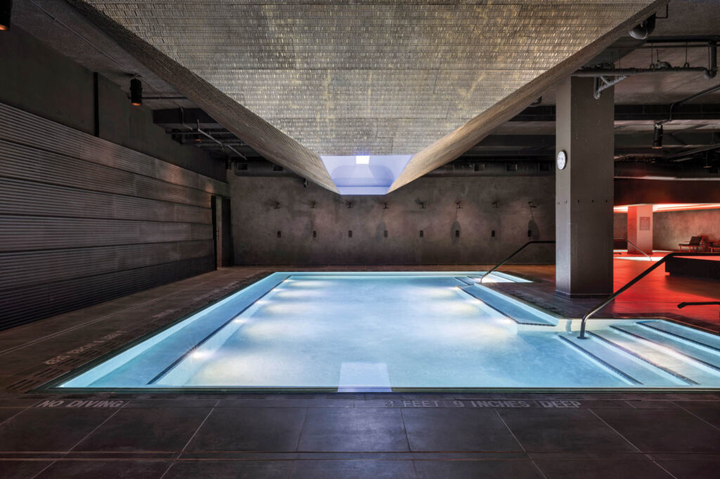 indoor pool that is gently lit up at night