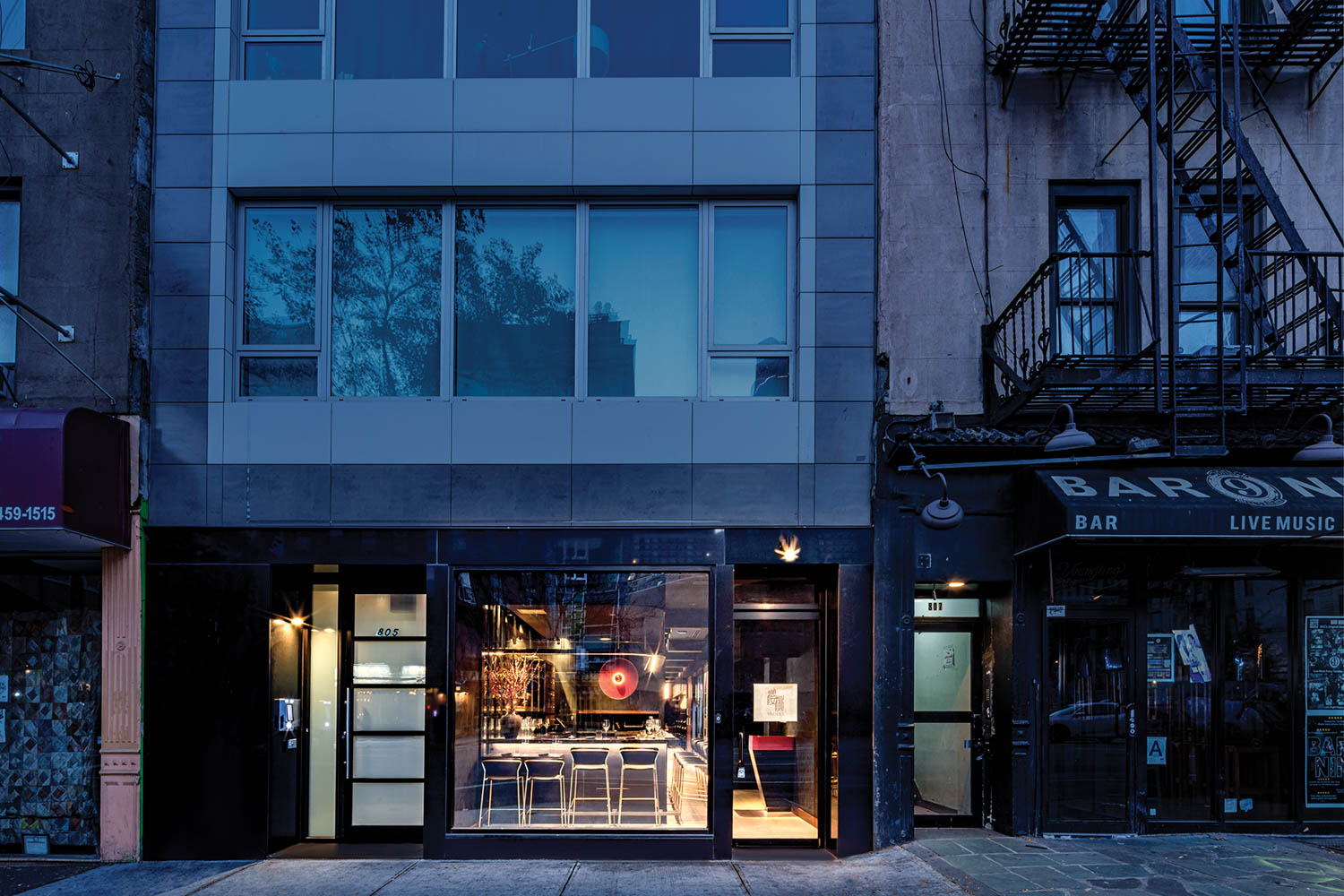 exterior facade of restaurant with sliding doors and windows