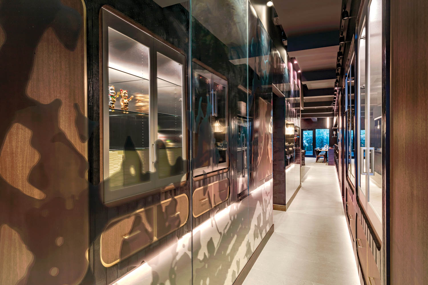 hallway with view of chefs cooking in the windows