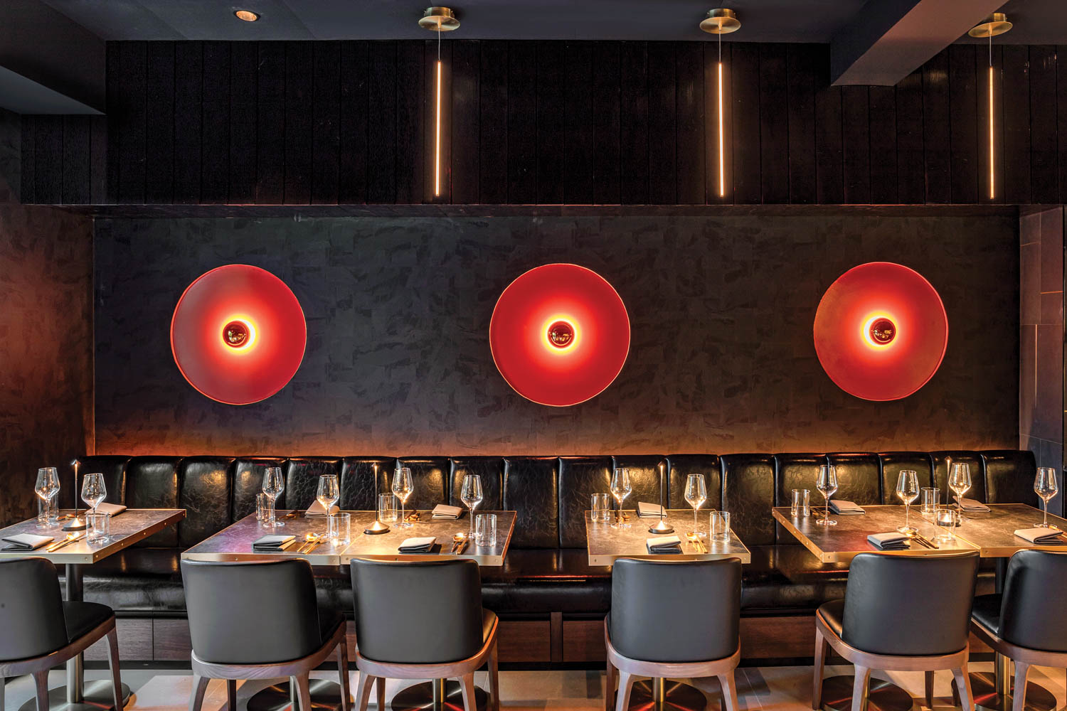 restaurant with black chairs and red lanterns