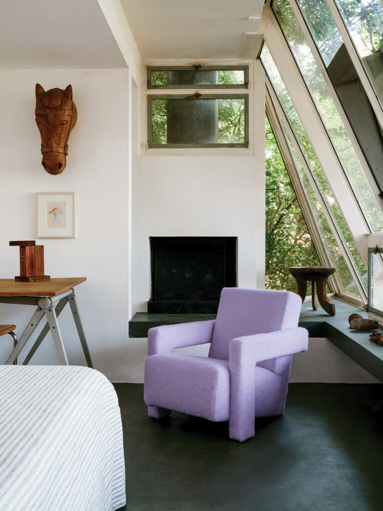 lavender chair in the corner nook of a room