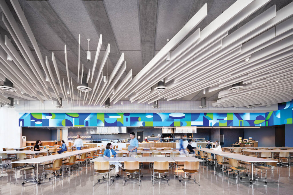 Dining area with many tables and white fan-like structures on top