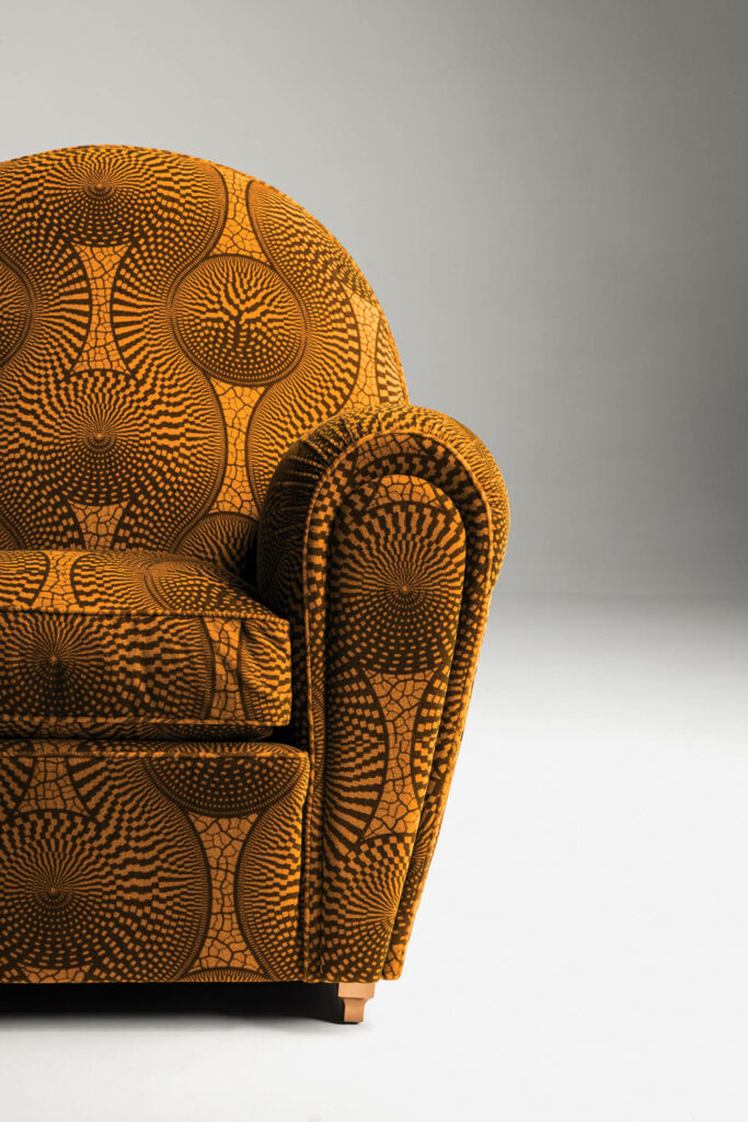 marigold colored armchair in room